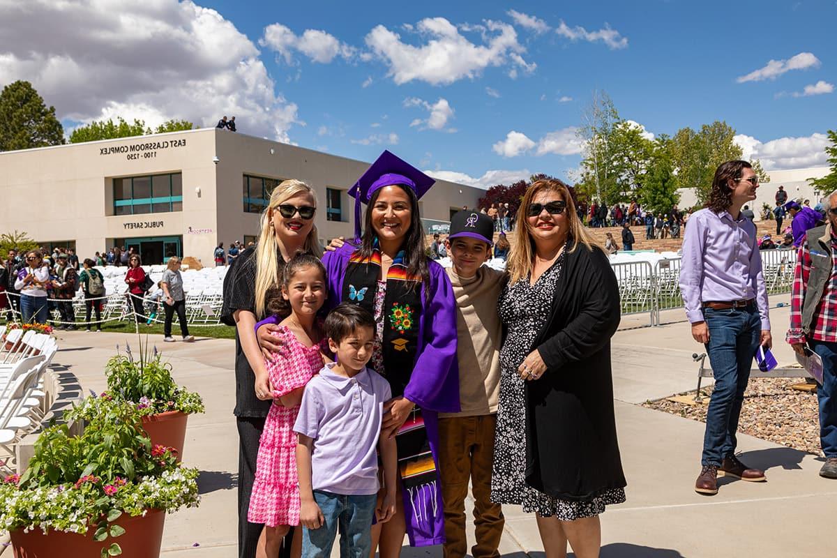 Family of San Juan College graduate celebrate and take photos together.